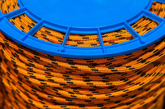 Spool of orange and black braided rope