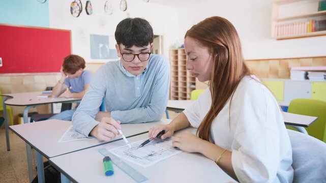 High school students collaborating on classroom assignment