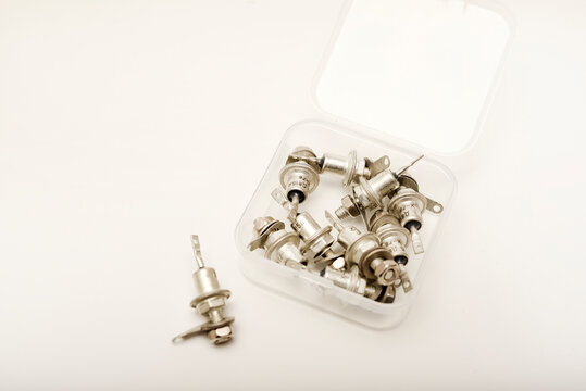 Iron zener diodes in a box. High‑power diodes. Old semiconductors.