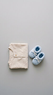 Baby shoes and shirt arrangement in modern commercial stock setting