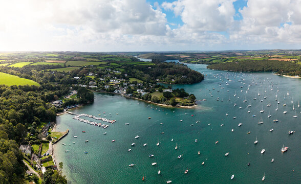 Aerial panorama of Helford village in Cornwall, UK with marina and sailing boats