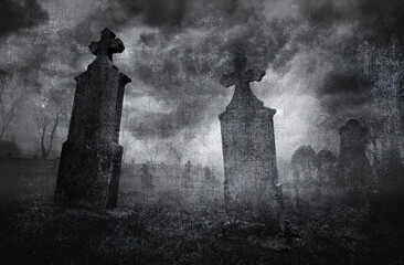 Fototapeta premium Old creepy graveyard on stormy winter day in black and white