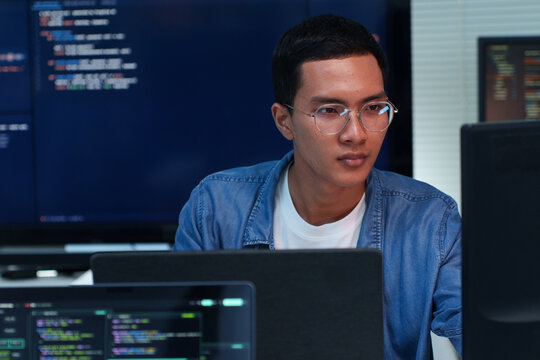 Focused Programmer Developing Digital Software