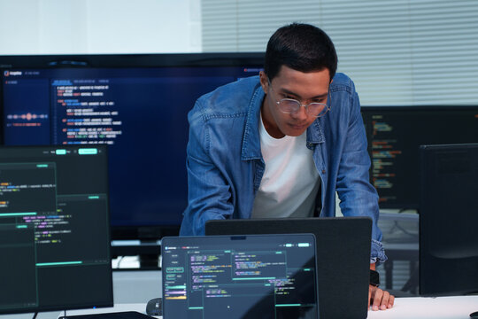 Programmer Developing Software with Digital Code