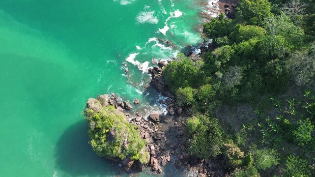 Aerial drone footage of Wedi Awu Banyu Anjlok beach coastline with turquoise water in Malang East Java