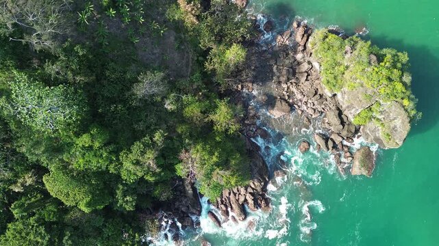 Aerial drone footage of Wedi Awu Banyu Anjlok beach coastline with turquoise water in Malang East Java
