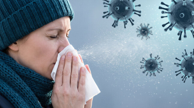 Woman sneezing into tissue with airborne virus particles illustrating seasonal respiratory infection and contagion.