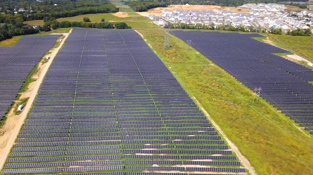 Virginia energy infrastructure meets expanding neighborhoods across an aerial panorama in 4K video.
