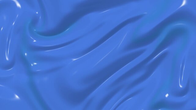 Blue silk fabric waving smoothly in gentle motion creating elegant glossy folds and soft reflections across the luxurious satin material texture during studio video shoot