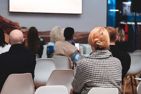 Business woman at business conference or presentation in conference room