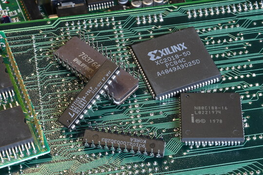 Florence, Italy - 23th december 2025: Vintage green computer motherboard with retro semiconductor components, microprocessors and microchips