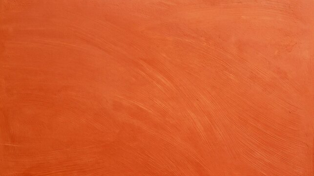 Close-up of an orange-colored surface. the surface appears to be smooth and smooth, with a rough texture. the color is a vibrant shade of orange, with some areas appearing darker and others lighter.