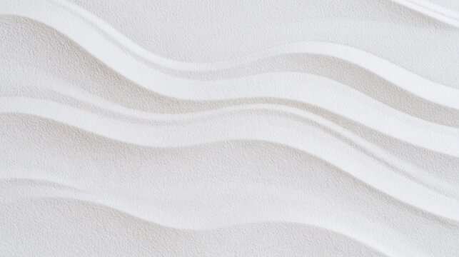 Close-up of a white surface with a textured pattern. the pattern is made up of wavy lines that create a wave-like effect.