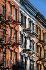Detail of SoHo building facades with metal fire escapes, colorful brick and stonework, New York City, USA © Francois Roux