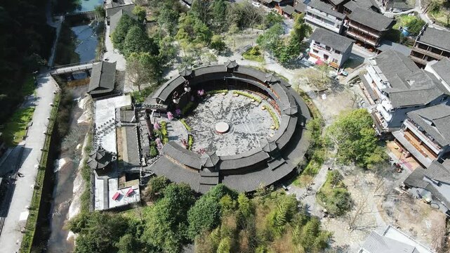 Aerial view of traditional circular tulou building in a Chinese village in Fujian, China