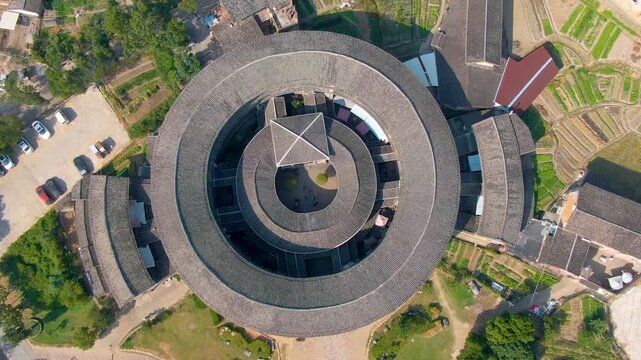 Aerial View of Traditional Circular Tulou Building in Rural Fujian Village, China in Fujian, China
