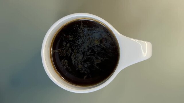 Black Coffee in a White Cup Seen Directly From Above