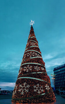Illuminated Christmas tree at night Gliwice city street in Poland