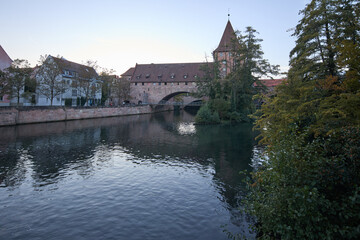 Fototapeta premium Historic medieval architecture and stone bridge over the Pegnitz river in Nuremberg Germany