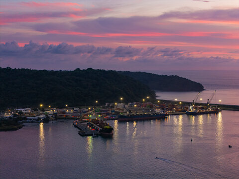 Port infrastructure with cargo ships at sunset in costa rica