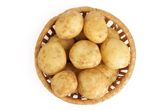 young potato in a wicker basket isolated on white background. Harvest new. Top view. Flat lay.