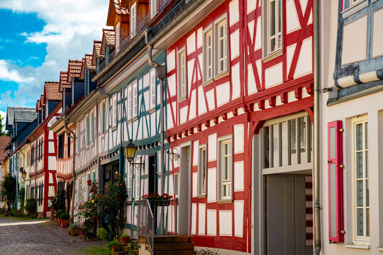 Colorful traditional half-timbered houses line Kreuzgasse in the historic old town of Idstein, Hesse, Germany, creating a picturesque architectural street scene.