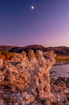 The moon watches over Mono Lake at dusk in California