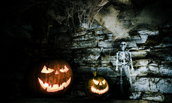 scary Halloween background with Jack'o'lanterns and skeleton