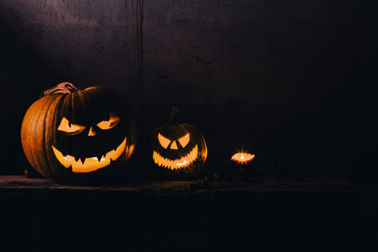 halloween background with jack'o'lanterns in the night