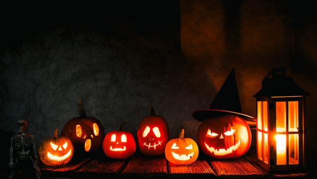 spooky Halloween background with jack'o'lanterns in the night

