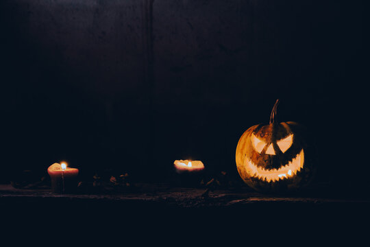 spooky Halloween background with jack'o'lanterns in the night

