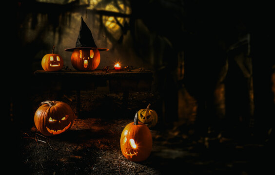 spooky Halloween background with jack'o'lanterns in the night