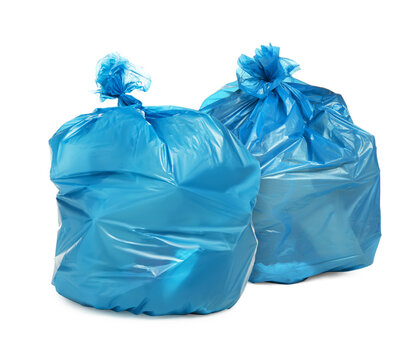 Two blue garbage bags isolated on white
