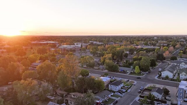 Aerial view of residential area at golden hour, tranquil and inviting