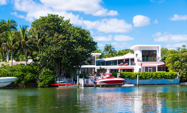 Luxury waterfront landscape. Sea vacation on summer. Luxury boat motor yacht in marina. Luxury yacht. Boating and yachting tourism. Luxurious lifestyle. Summer vacation. Docked yacht at private area