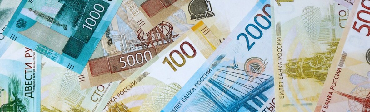 Russian ruble money bills in pile on table. Russia RUB currency cash close up