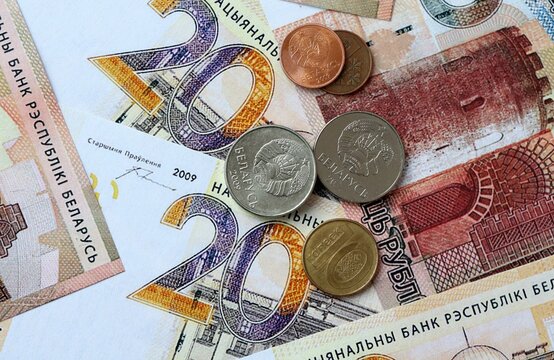Belarusian ruble money banknotes and coins on table. Belarus cash bills of BYN currency