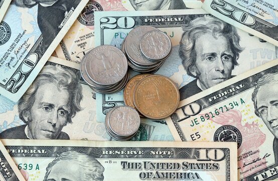 US dollar money 10 and 20 banknotes and coins on table. United States cash bills of USD currency