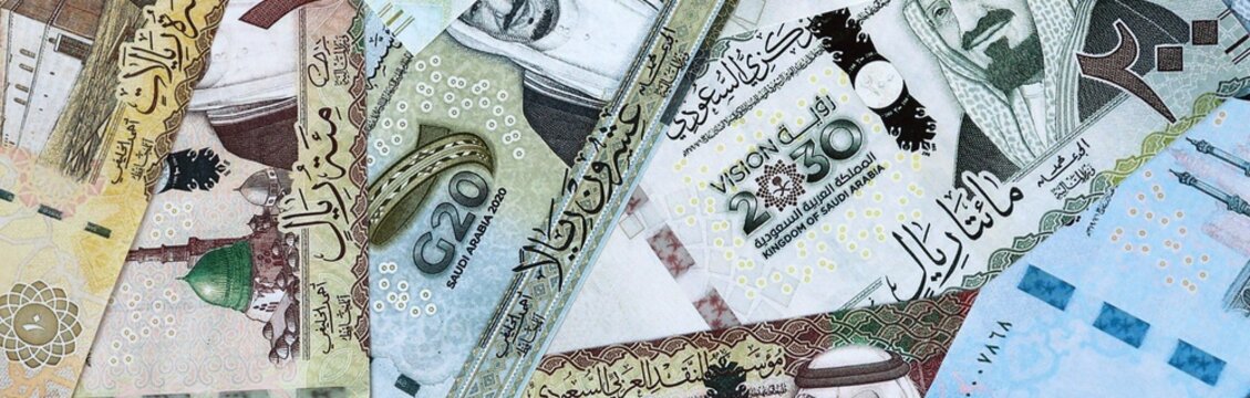Saudi riyal money bills in pile. Big amount of Saudi Arabia SAR currency cash close up
