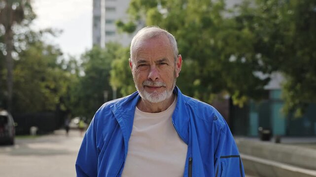 Portrait of senior man smiling looking camera wearing sports jacket. Active and healthy retirement 