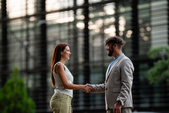 Business people shaking hands confirming a successful agreement