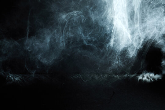 Abstract smoke fog vapor on black background