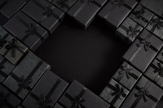 Black gift boxes forming heart shape with copy space