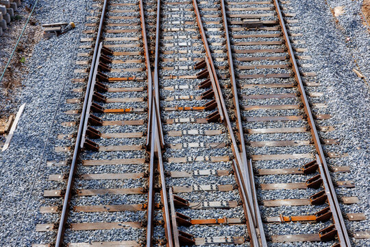 Multiple railroad tracks forming a junction diverging