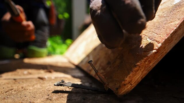 Construction worker installing roofing underlayment on a roof 