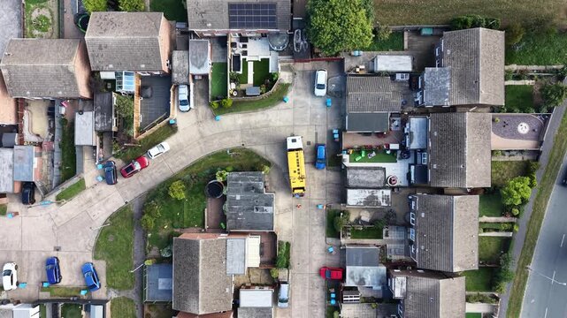 aerial view of refuse collecting lorry collecting domestic rubbish from homes using the wheelie bin system, City waste manage and recycling  