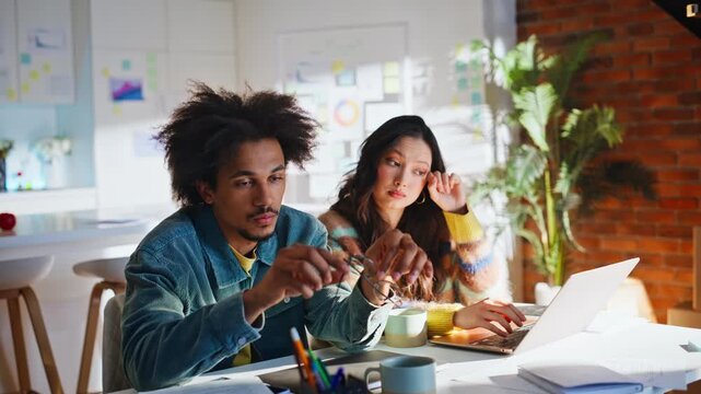 Exhausted coworkers end workday creative loft office. Multiethnic team fatigue.