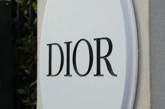 Saint-Tropez, France - August 28, 2024: Close-up Dior boutique sign outdoors