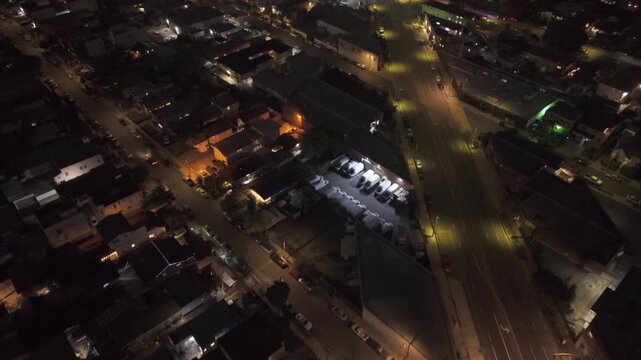 Aerial night shot flyover city streets