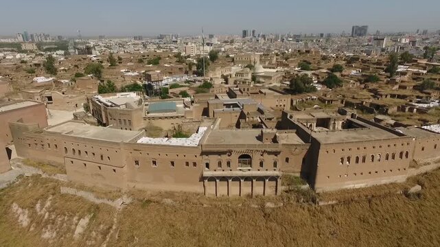 Drone flying over the citadel walls into the historic houses inside the Erbil Citadel, Kurdistan